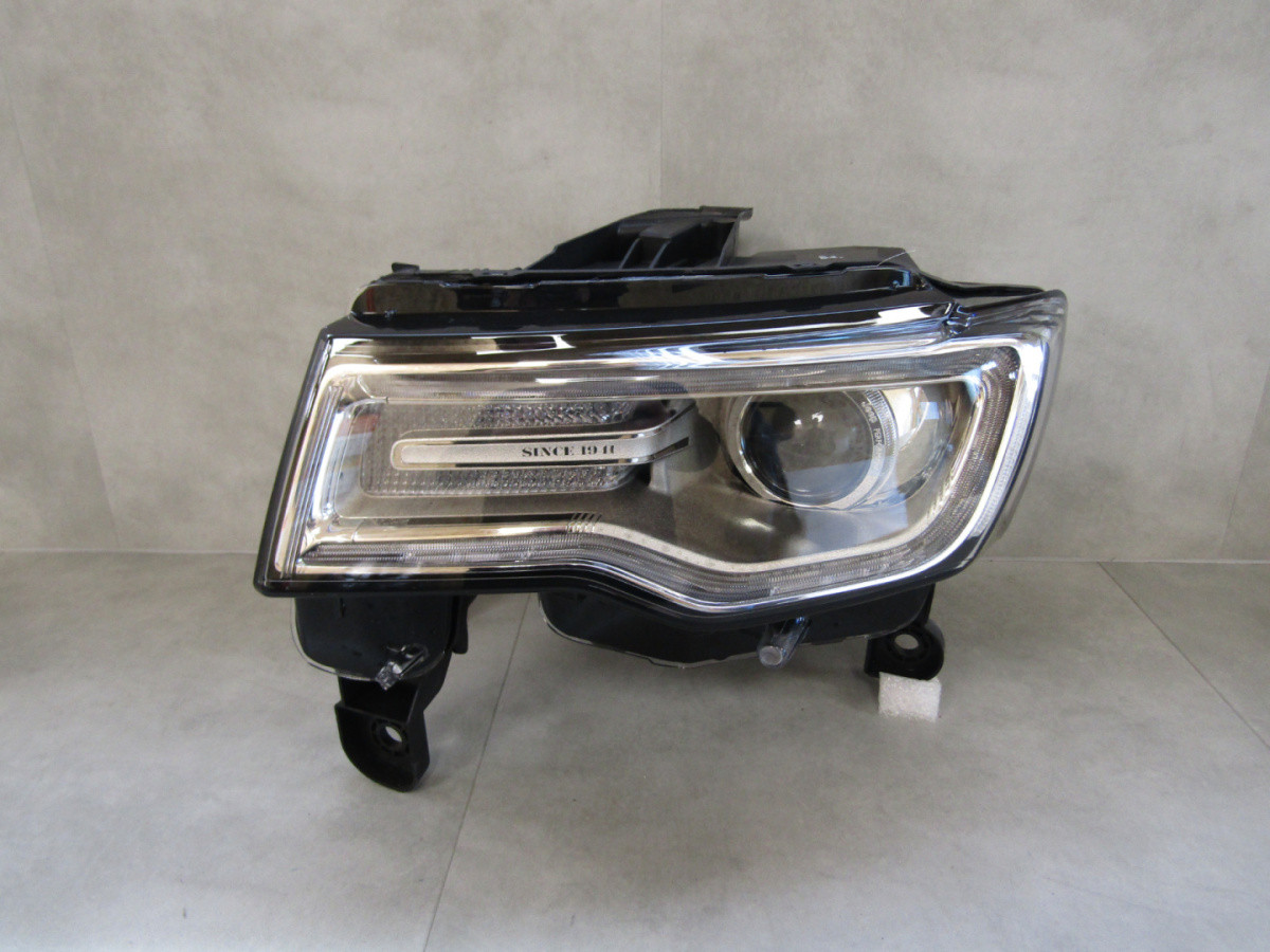 KOPLAMP JEEP GRAND CHEROKEE WK2 XENON DRAAIEN 13-16 LH A931/E103